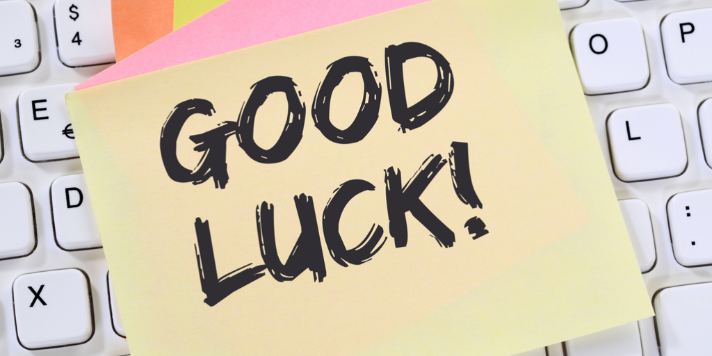 Post-it notes with "Good luck!" written on them on a computer keyboard