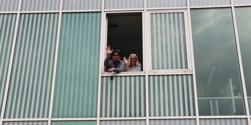 Domen & Maja waving from the new office