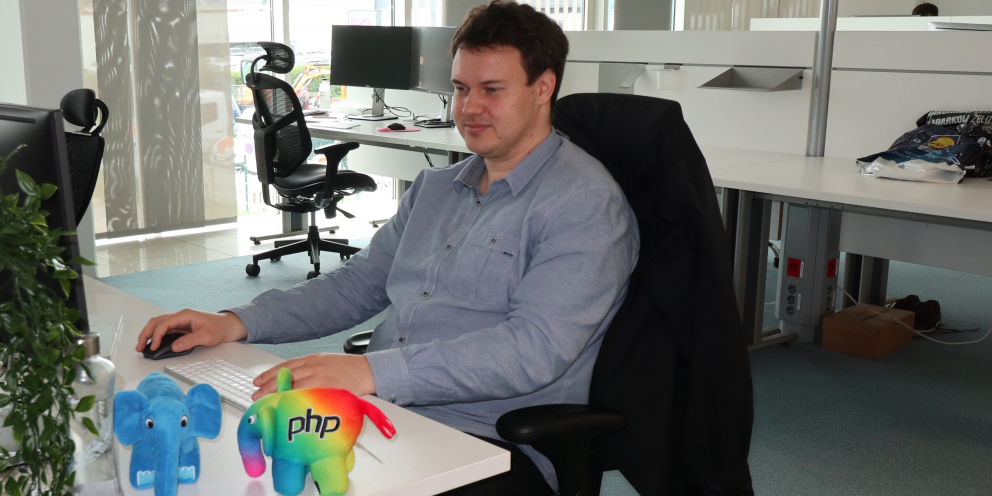Peter, one of the release managers of PHP 7.4, working at his desk with elePHPant
