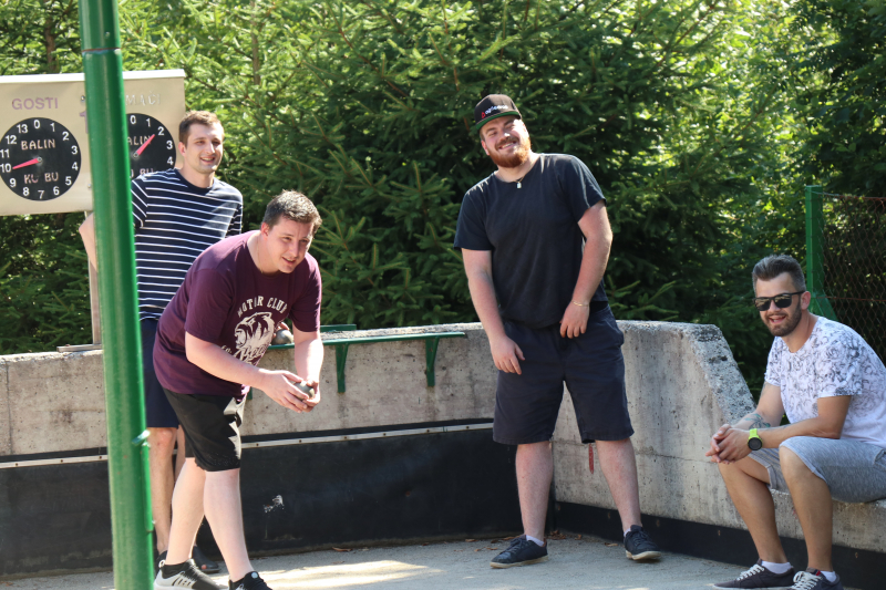 Agiledrop team cooling off in the shade by playing a relaxed game of bowls